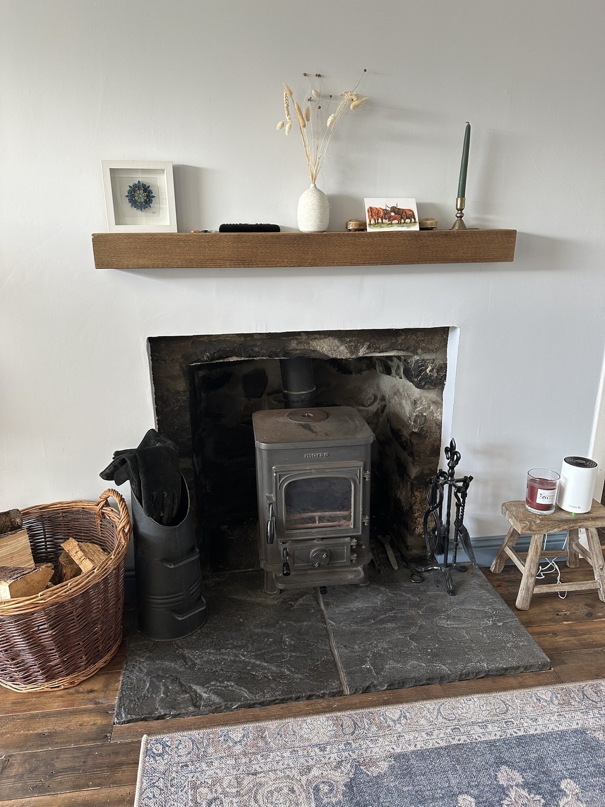 Wood burner and fireplace in the living room at Gleann Síth House